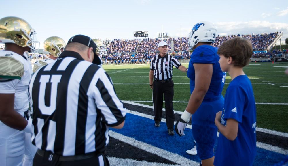 GVL/Kevin Sielaff - Grand Valley and Tiffin meet at center field for the coin toss. Grand Valley defeats Tiffin with a final score of 45-7 on Thursday, September 1, 2016 at Lubbers Stadium.