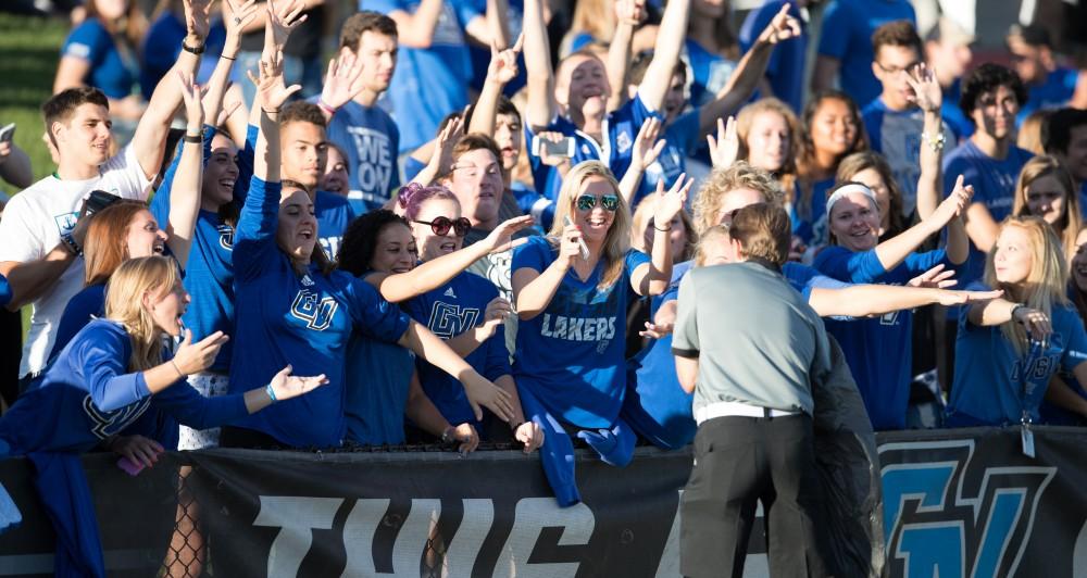 GVL/Kevin Sielaff - Fans jump as they try to snag a tee shirt from the tee shirt toss. Grand Valley defeats Tiffin with a final score of 45-7 on Thursday, September 1, 2016 at Lubbers Stadium.