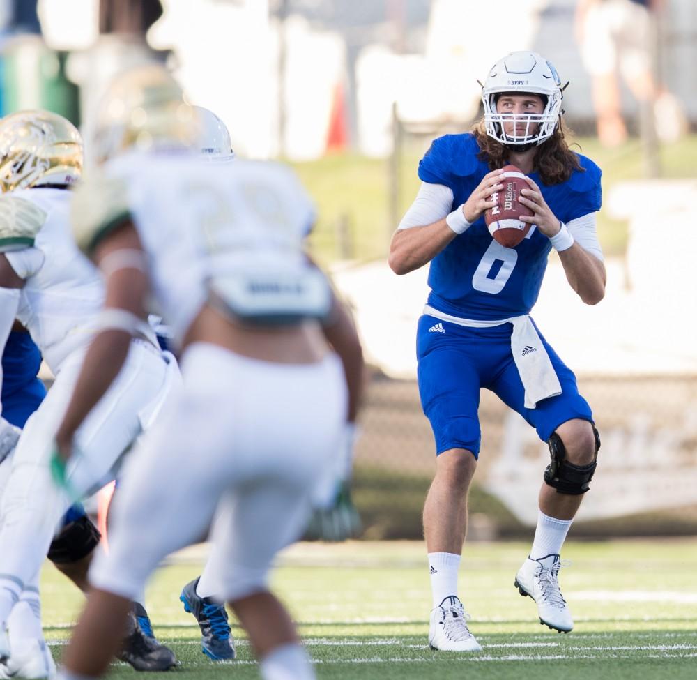 GVL/Kevin Sielaff - Bart Williams (6) moves back in the pocket and looks to pass. Grand Valley defeats Tiffin with a final score of 45-7 on Thursday, September 1, 2016 at Lubbers Stadium.