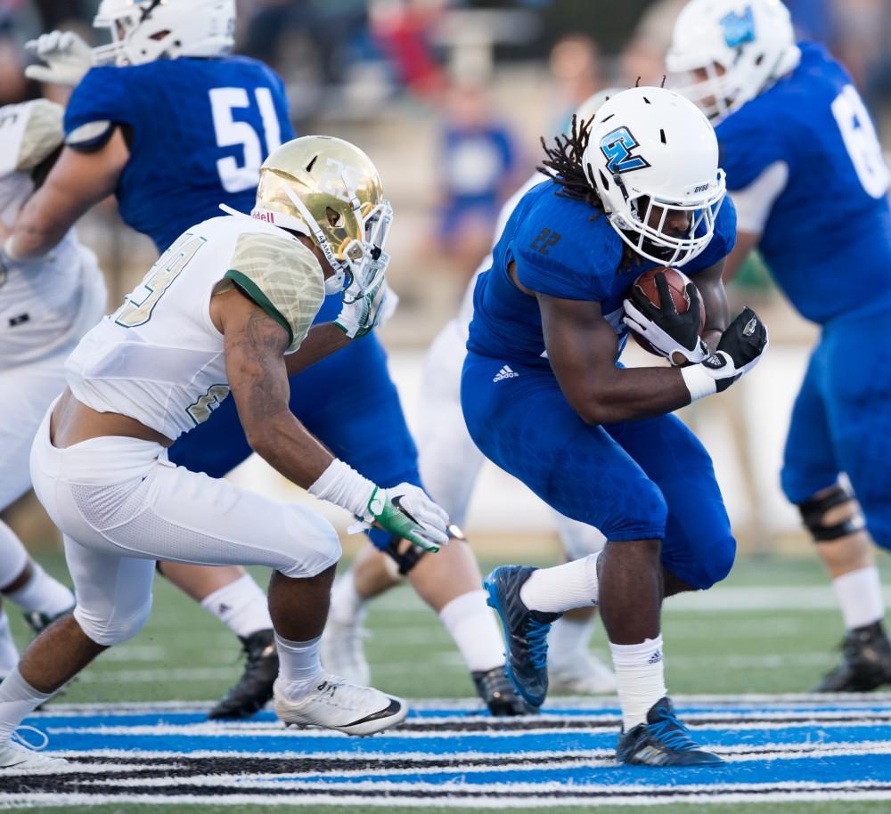 GVL/Kevin Sielaff - 	Terrell Dorsey (22) carries the football up field. Grand Valley defeats Tiffin with a final score of 45-7 on Thursday, September 1, 2016 at Lubbers Stadium.