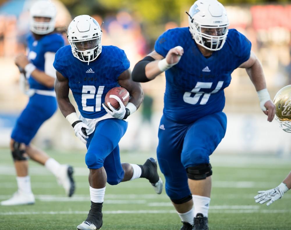 GVL/Kevin Sielaff - 	Marty Carter (21) moves the football up field and pushes toward the end zone. Grand Valley defeats Tiffin with a final score of 45-7 on Thursday, September 1, 2016 at Lubbers Stadium.