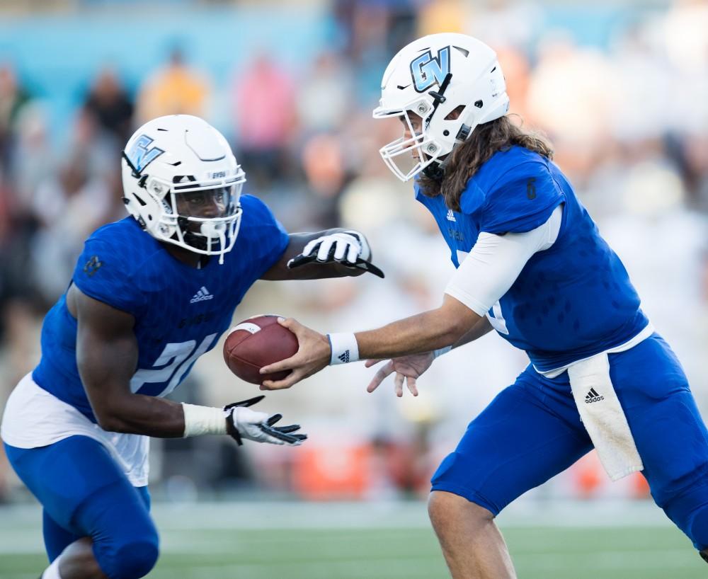 GVL/Kevin Sielaff - 	Marty Carter (21) moves the football up field and pushes toward the end zone. Grand Valley defeats Tiffin with a final score of 45-7 on Thursday, September 1, 2016 at Lubbers Stadium.