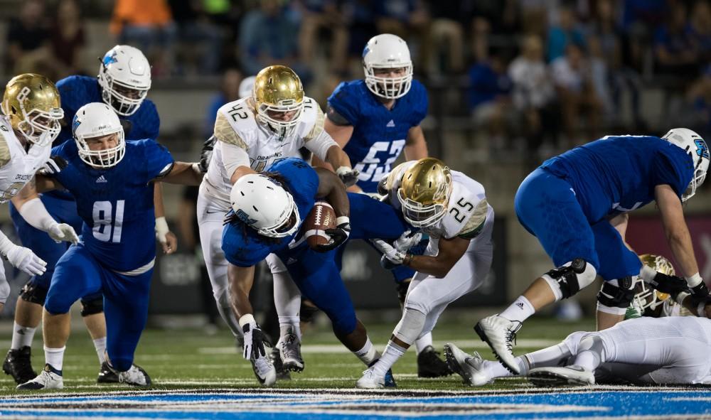 GVL/Kevin Sielaff -Terrell Dorsey (22) is taken down by Tiffin's Roamelle Bell (25). Grand Valley defeats Tiffin with a final score of 45-7 on Thursday, September 1, 2016 at Lubbers Stadium.