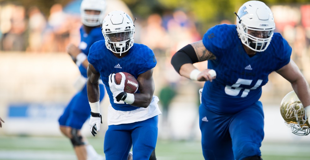 GVL/Kevin Sielaff - Marty Carter (21) moves the ball toward the end zone. Grand Valley defeats Tiffin with a final score of 45-7 on Thursday, September 1, 2016 at Lubbers Stadium.