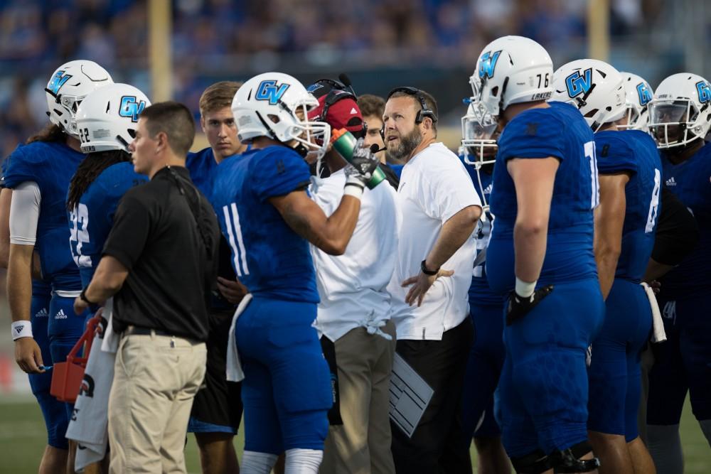 GVL/Kevin Sielaff - Head coach Matt Mitchell directs his team within the huddle. Grand Valley defeats Tiffin with a final score of 45-7 on Thursday, September 1, 2016 at Lubbers Stadium.