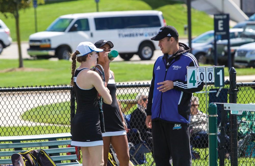 GVL / Sara CarteGrand Valley’s Women’s Tennis coach, John Black, coaches his players between matches against Northwood University on Sunday, September 13, 2015.