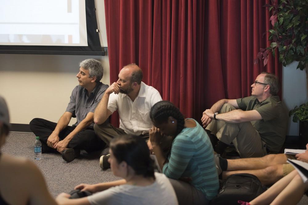 GVL / Luke Holmes - People sit on the floor for a packed lecture. Hispanic Heritage Month gets started with a lecture in Kirkhof on Thursday, Sept. 22, 2016.