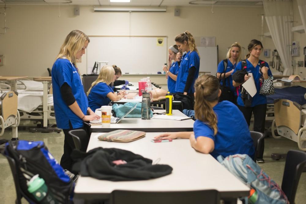 GVL / Luke Holmes - Nursing Students finish up some work after class in the Center for Health Sciences building downtown.