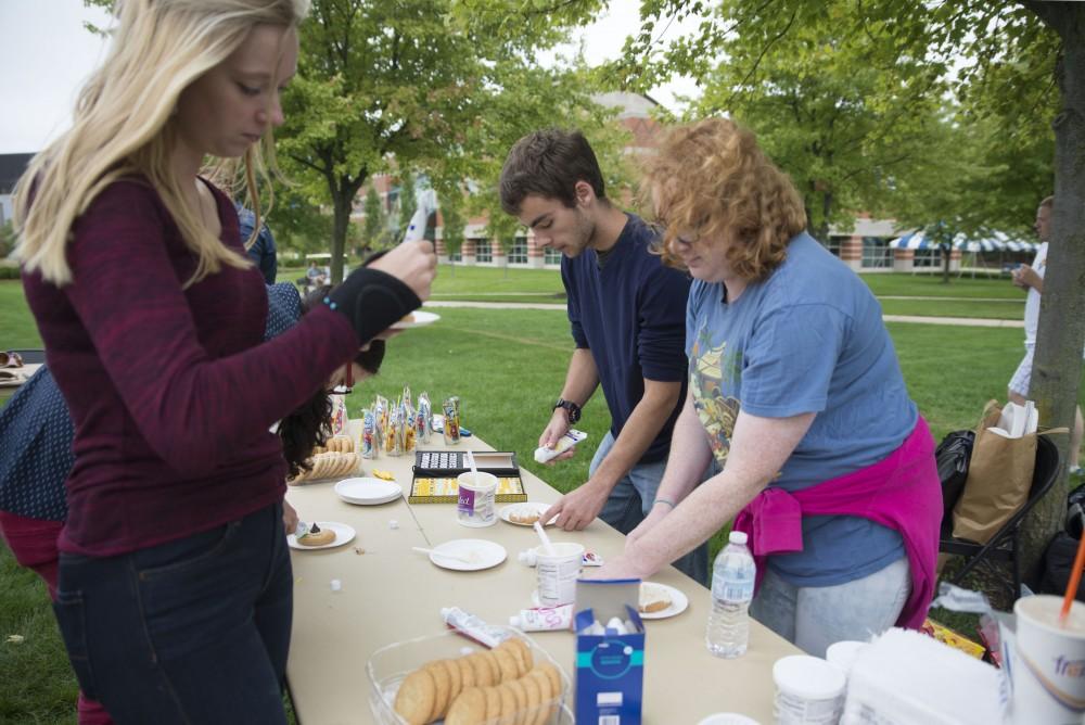 GVL / Luke Holmes - Students decorate cookies. The Paleo-Olympics were held in the KC West Lawn on Friday, Sept. 23, 2016.