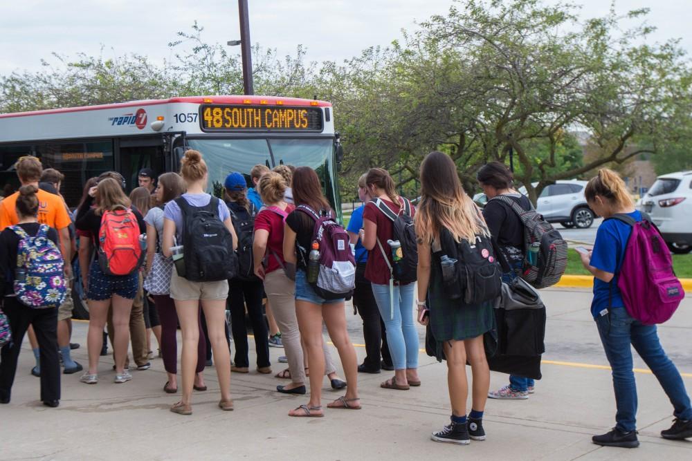 GVL/Mackenzie Bush - Students gather at various Rapid bus stops Thursday, Sept. 22, 2016.