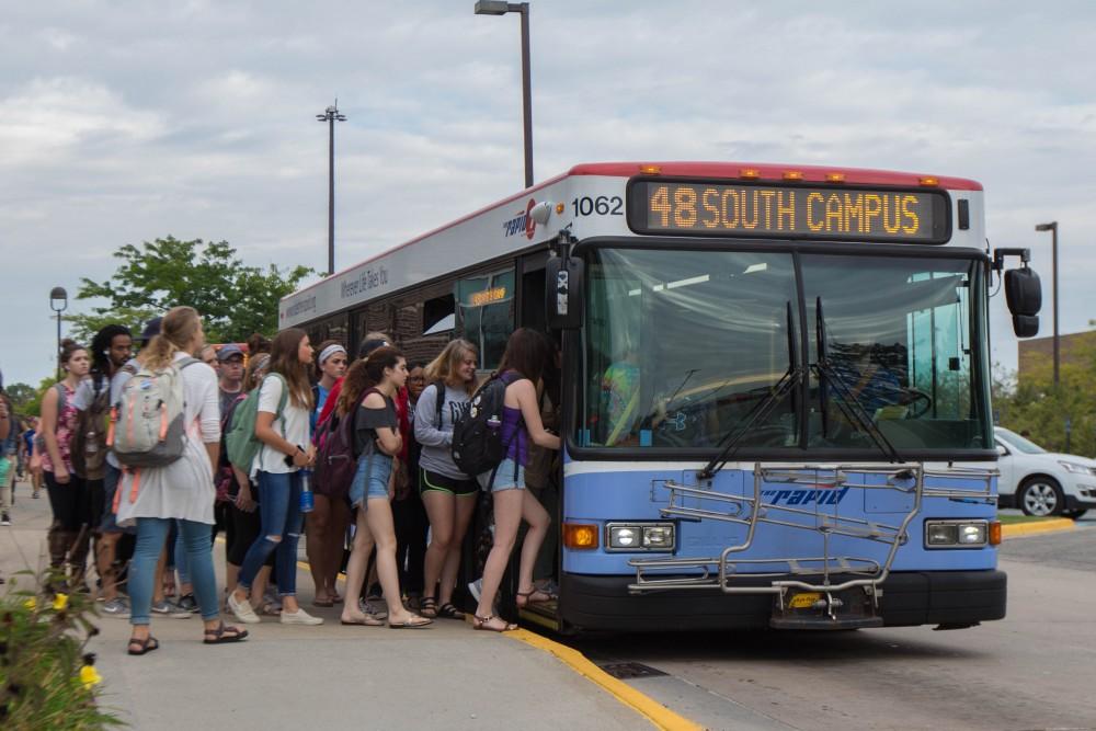 GVL/Mackenzie Bush - Students gather at various Rapid bus stops Thursday, Sept. 22, 2016.