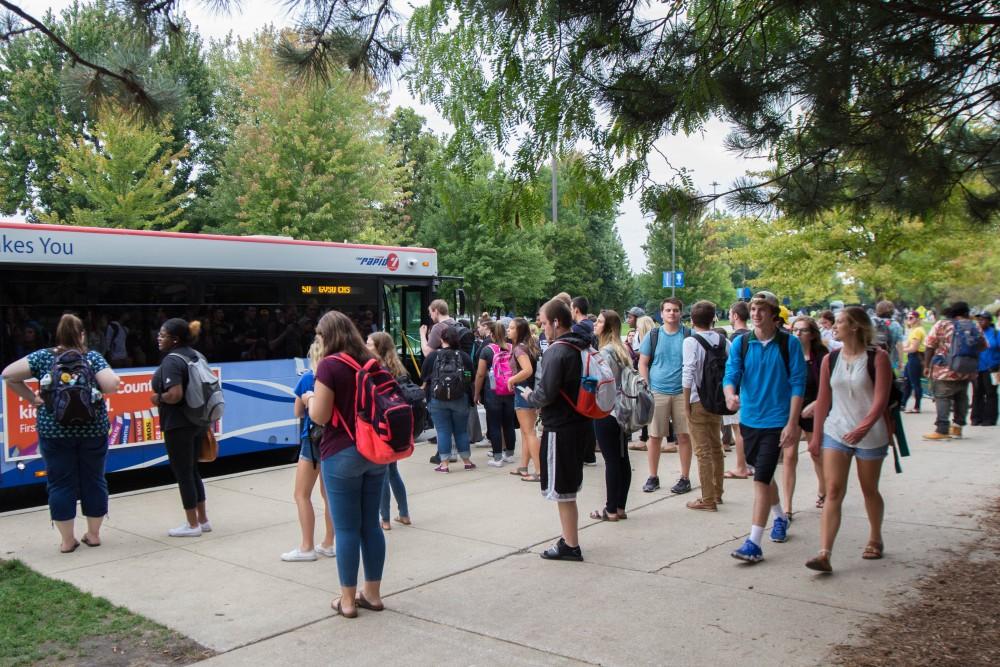 GVL/Mackenzie Bush - Students gather at various Rapid bus stops Thursday, Sept. 22, 2016.