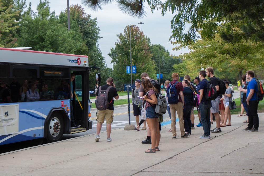 GVL/Mackenzie Bush - Students gather at various Rapid bus stops Thursday, Sept. 22, 2016.