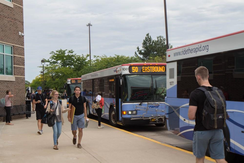 GVL/Mackenzie Bush - Students gather at various Rapid bus stops Thursday, Sept. 22, 2016.