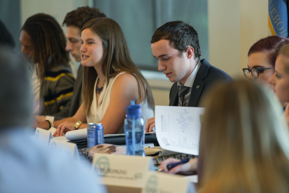 GVL / Luke Holmes - Sean O'Melia looks over his papers during the meeting. Student Senate held their first meeting of the year in the Pere Marquette Room Thursday, Sep. 1, 2016.