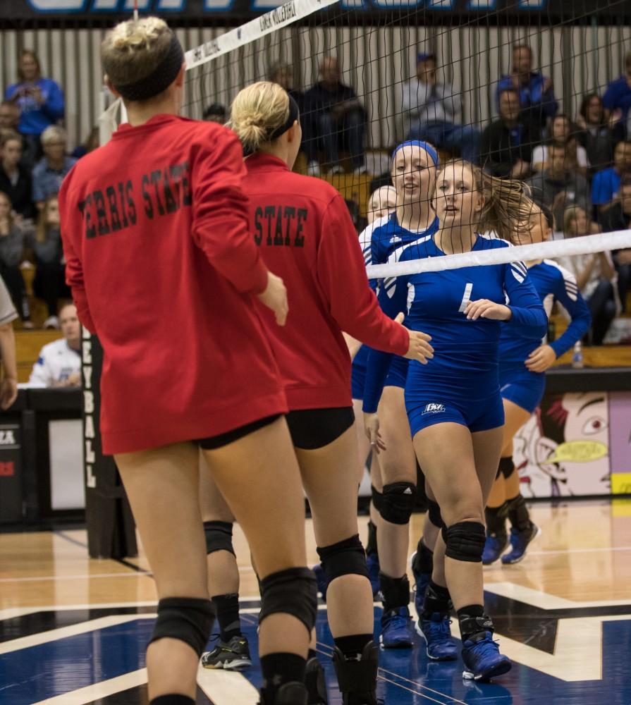 GVL/Kevin Sielaff - Sydney Benchley (1) shakes hands with Ferris players before the match. The Lakers fall to the Bulldogs of Ferris State with a final score of 1-3 Tuesday, Sept. 27, 2016 in Allendale.