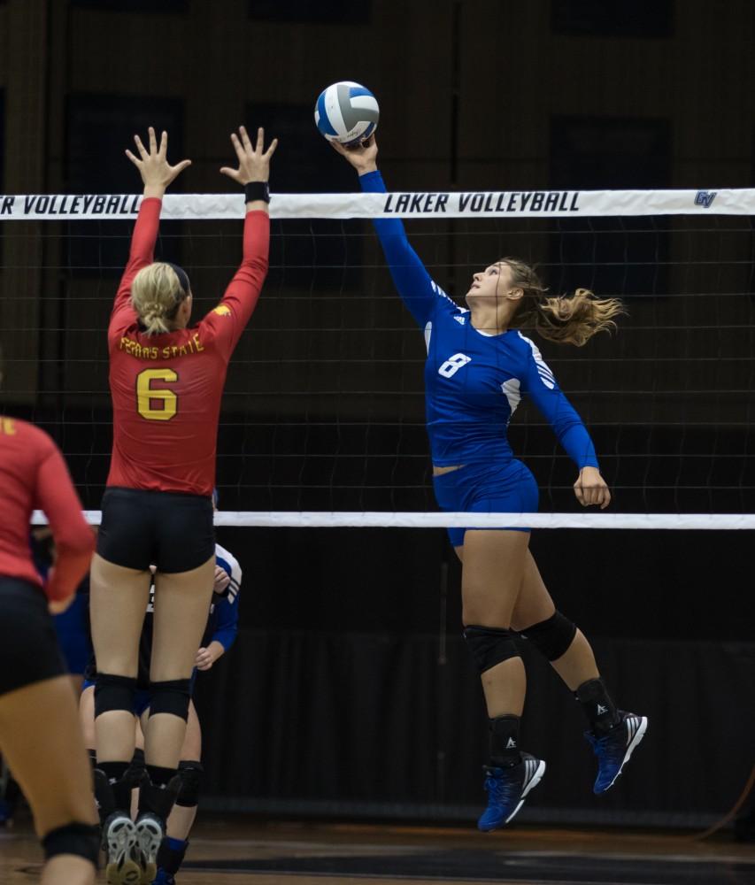 GVL/Kevin Sielaff - Brooke Smith (8) taps the ball over the net. The Lakers fall to the Bulldogs of Ferris State with a final score of 1-3 Tuesday, Sept. 27, 2016 in Allendale.