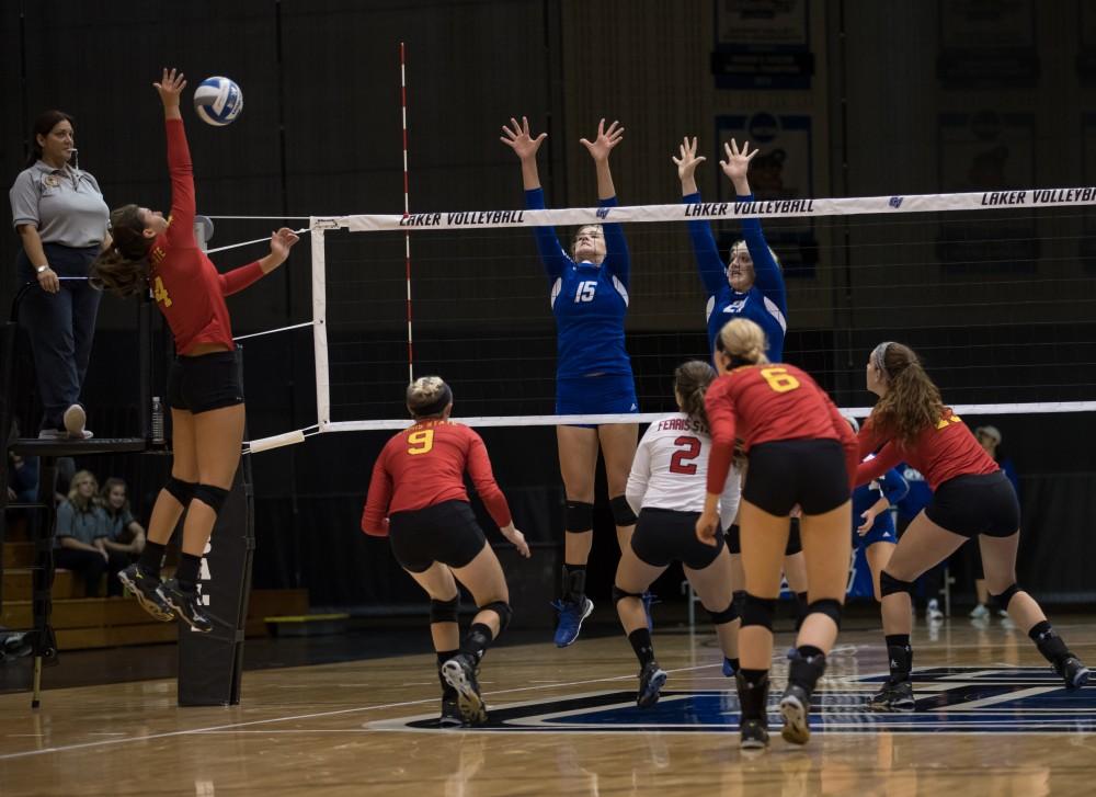 GVL/Kevin Sielaff - Jayci Suseland (15) leaps up to try to make a block. The Lakers fall to the Bulldogs of Ferris State with a final score of 1-3 Tuesday, Sept. 27, 2016 in Allendale.