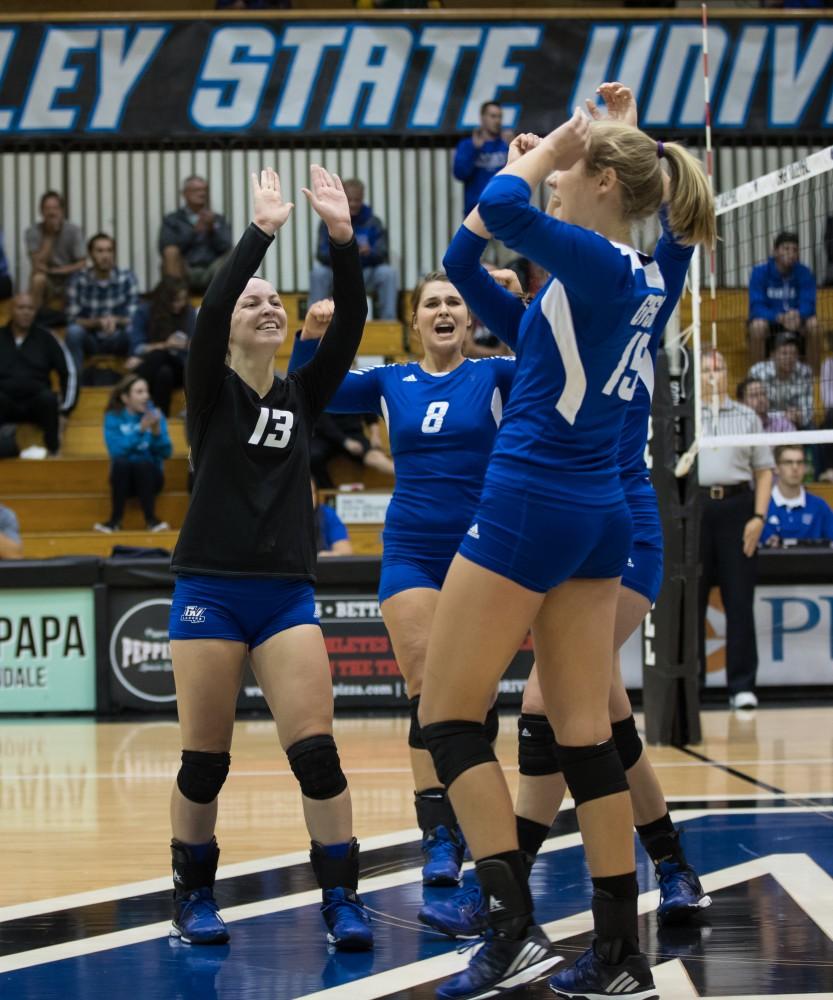 GVL/Kevin Sielaff - Amanda Glaza (13) and company celebrate a Grand Valley point. The Lakers fall to the Bulldogs of Ferris State with a final score of 1-3 Tuesday, Sept. 27, 2016 in Allendale.