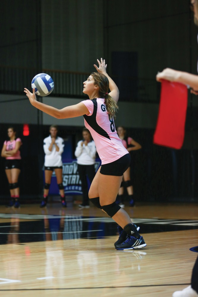 GVL / Kevin Sielaff - Brooke Smith (8) serves the ball. Grand Valley squares off against Ohio Dominican and claims the victory with a final score of 3-1.