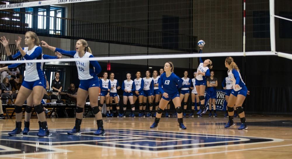 GVL/Kevin Sielaff - Katie Olson (9) serves the ball. The Lakers sweep the Cavaliers of Walsh University Saturday, Sept. 24, 2016 in Allendale.