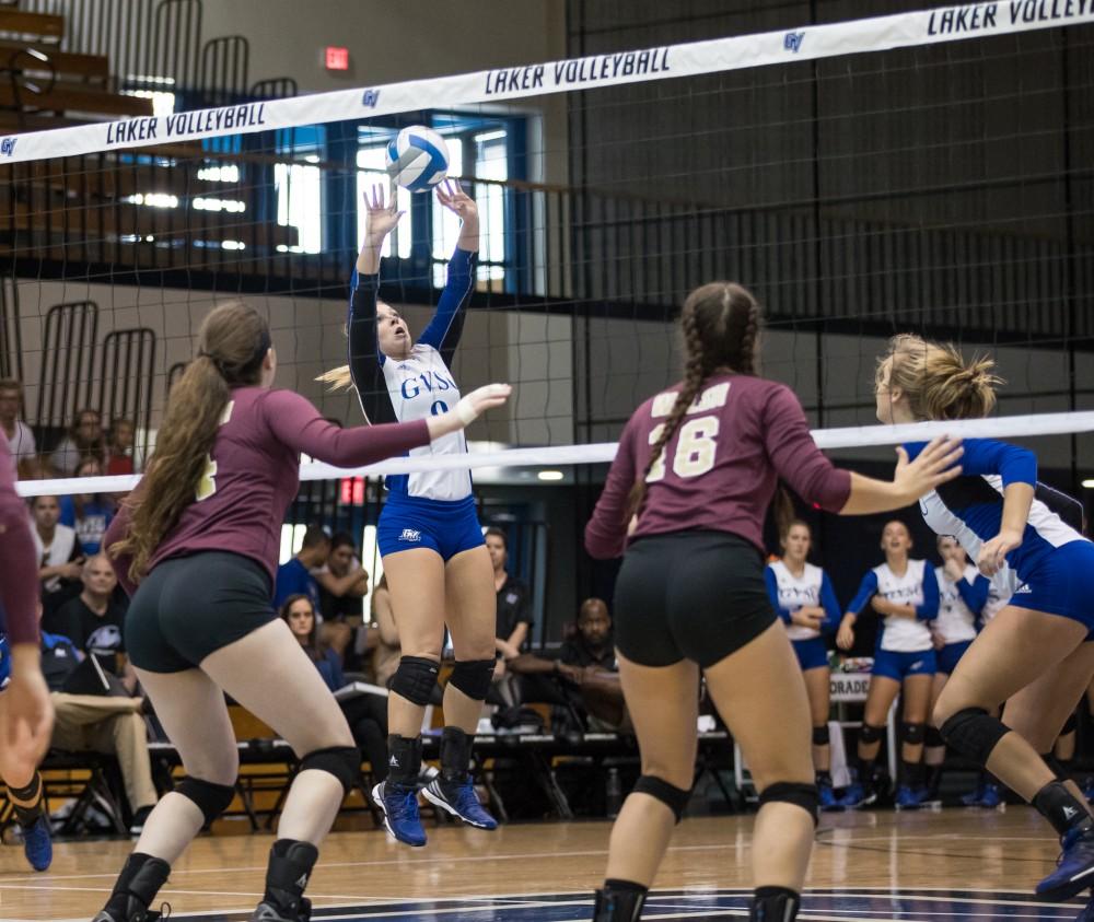 GVL/Kevin Sielaff - Katie Olson (9) sets the ball. The Lakers sweep the Cavaliers of Walsh University Saturday, Sept. 24, 2016 in Allendale.