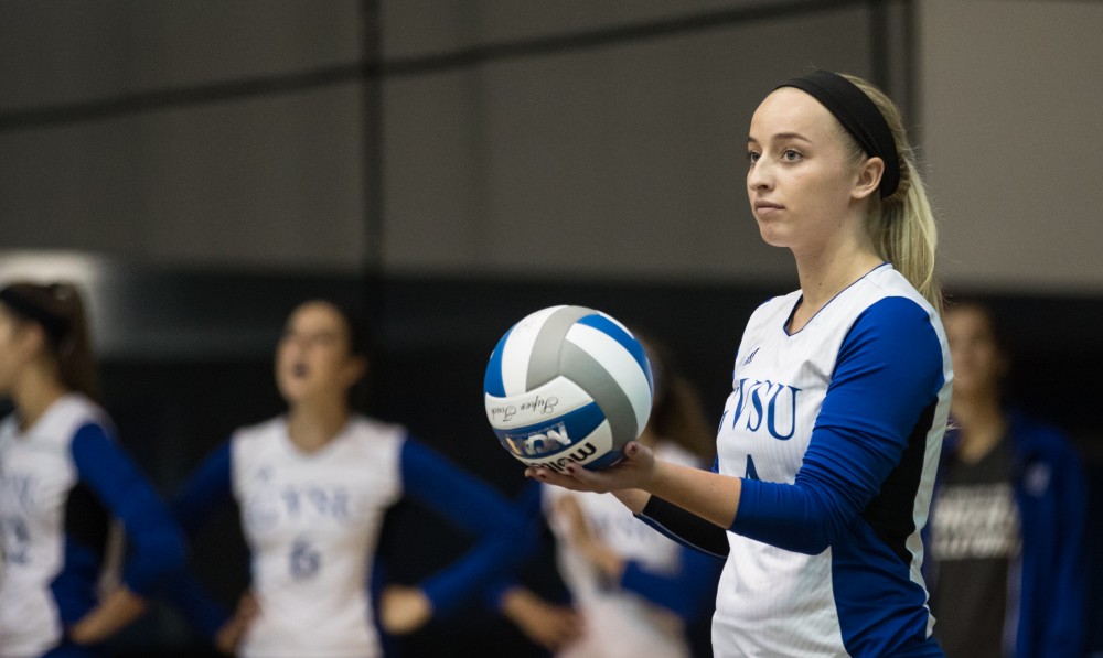 GVL/Kevin Sielaff - Kaylene Norris (4) serves the ball. The Lakers sweep the Cavaliers of Walsh University Saturday, Sept. 24, 2016 in Allendale.