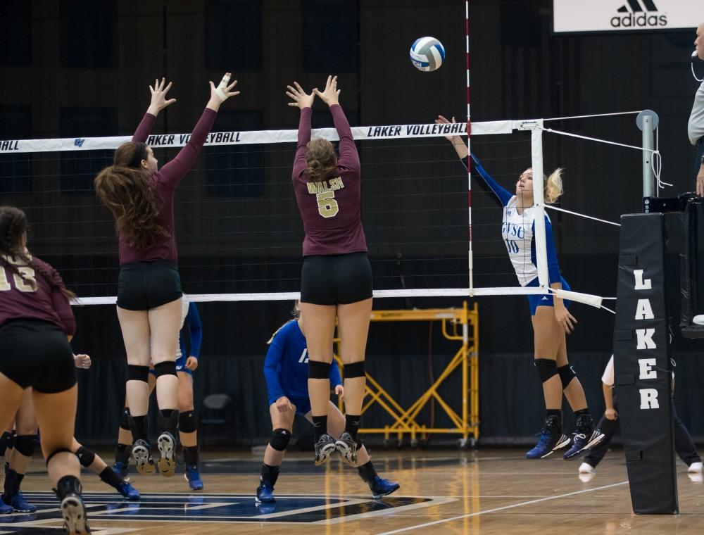 GVL/Kevin Sielaff - Madilyn Keller (10) sends the ball over the net. The Lakers sweep the Cavaliers of Walsh University Saturday, Sept. 24, 2016 in Allendale.