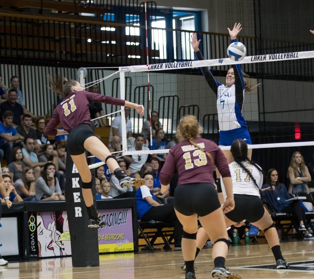 GVL/Kevin Sielaff - Danielle McCormick (7) blocks a Walsh spikes for a Grand Valley point. The Lakers sweep the Cavaliers of Walsh University Saturday, Sept. 24, 2016 in Allendale.