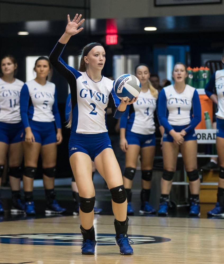 GVL/Kevin Sielaff - Kendall Yerkes (2) serves the ball. The Lakers sweep the Cavaliers of Walsh University Saturday, Sept. 24, 2016 in Allendale.