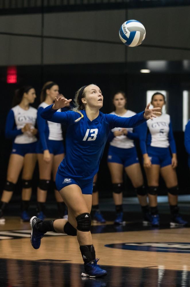 GVL/Kevin Sielaff - Amanda Glaza (13) serves the ball. The Lakers sweep the Cavaliers of Walsh University Saturday, Sept. 24, 2016 in Allendale.