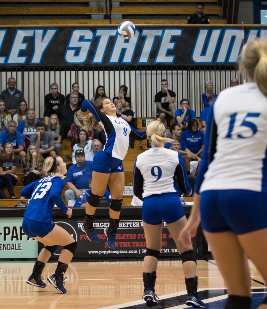 GVL/Kevin Sielaff - Brooke Smith (8) rises up and looks to spike. The Lakers sweep the Cavaliers of Walsh University Saturday, Sept. 24, 2016 in Allendale.