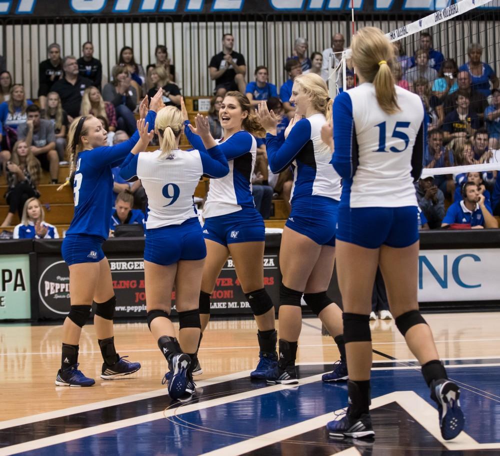 GVL/Kevin Sielaff - Brooke Smith (8) and company celebrate a Grand Valley point. The Lakers sweep the Cavaliers of Walsh University Saturday, Sept. 24, 2016 in Allendale.