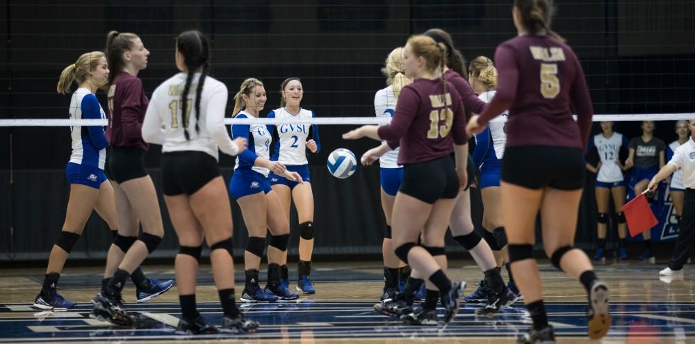 GVL/Kevin Sielaff - Katie Olson (9) and company celebrate a Grand Valley point. The Lakers sweep the Cavaliers of Walsh University Saturday, Sept. 24, 2016 in Allendale.