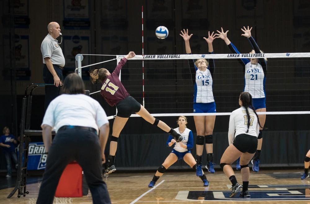 GVL/Kevin Sielaff - Jayci Suseland (15) and Staci Brower (21) jump up to block a Walsh spike. The Lakers sweep the Cavaliers of Walsh University Saturday, Sept. 24, 2016 in Allendale.