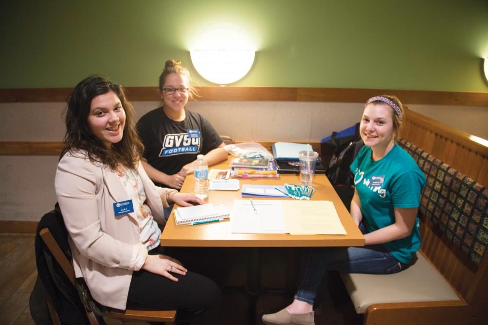 GVL/ArchiveWriting consultant Allie Gonzales works with a group of students inside of the Kleiner Commons Sunday, April 12, 2015 as part of the Writing Where You Are event.