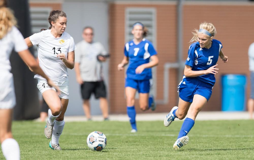 GVL/Kevin Sielaff - Kendra Stauffer (5) crosses the ball. The Lakers defeat the Panthers of Ohio Dominican with a final score of 4-0 on Sunday, Sept. 18, 2016 in Allendale.