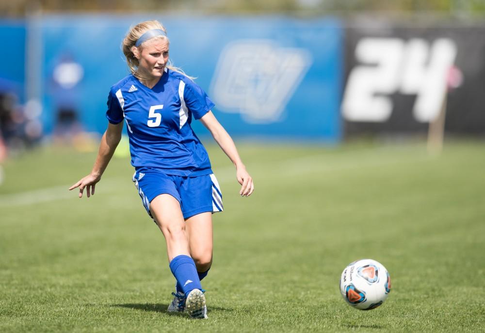 GVL/Kevin Sielaff - Kendra Stauffer (5) crosses the ball. The Lakers defeat the Panthers of Ohio Dominican with a final score of 4-0 on Sunday, Sept. 18, 2016 in Allendale.