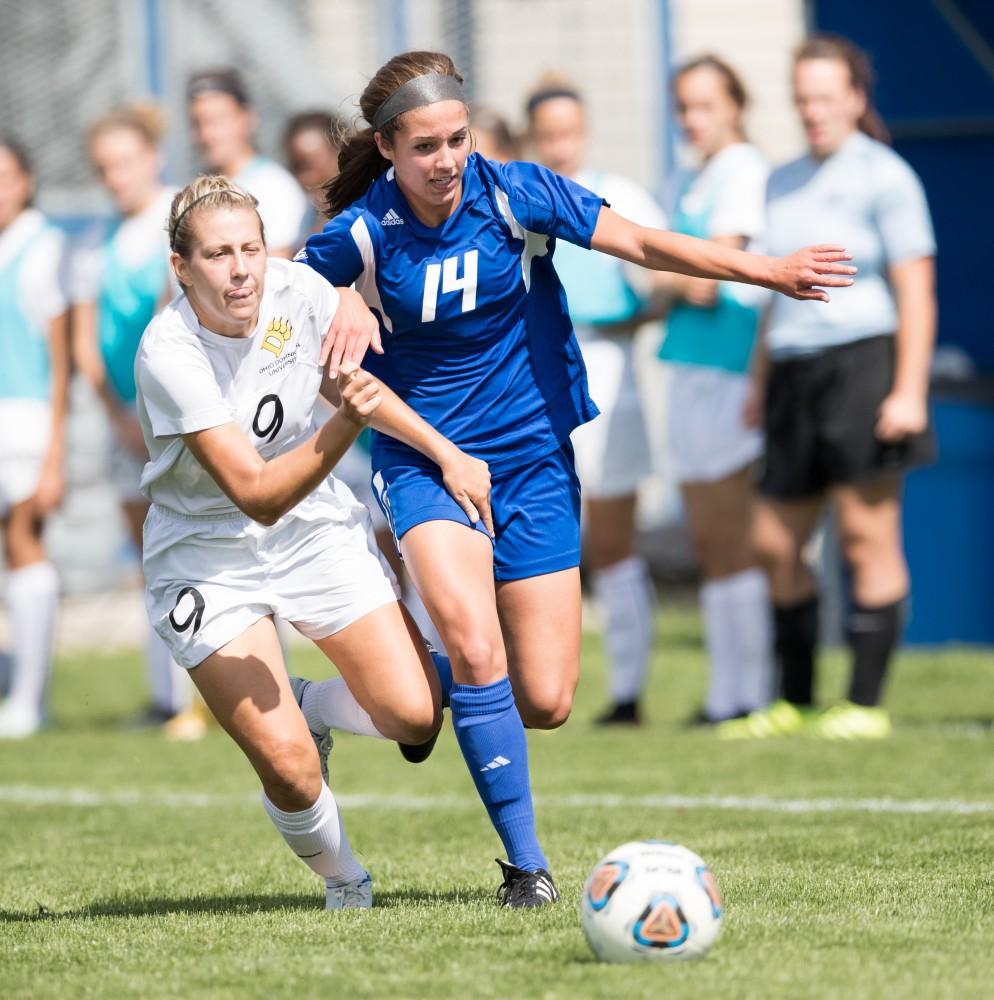 GVL/Kevin Sielaff - Mackenzie Fox (14) handles the ball and shakes off an Ohio Dominican defender. The Lakers defeat the Panthers of Ohio Dominican with a final score of 4-0 on Sunday, Sept. 18, 2016 in Allendale.