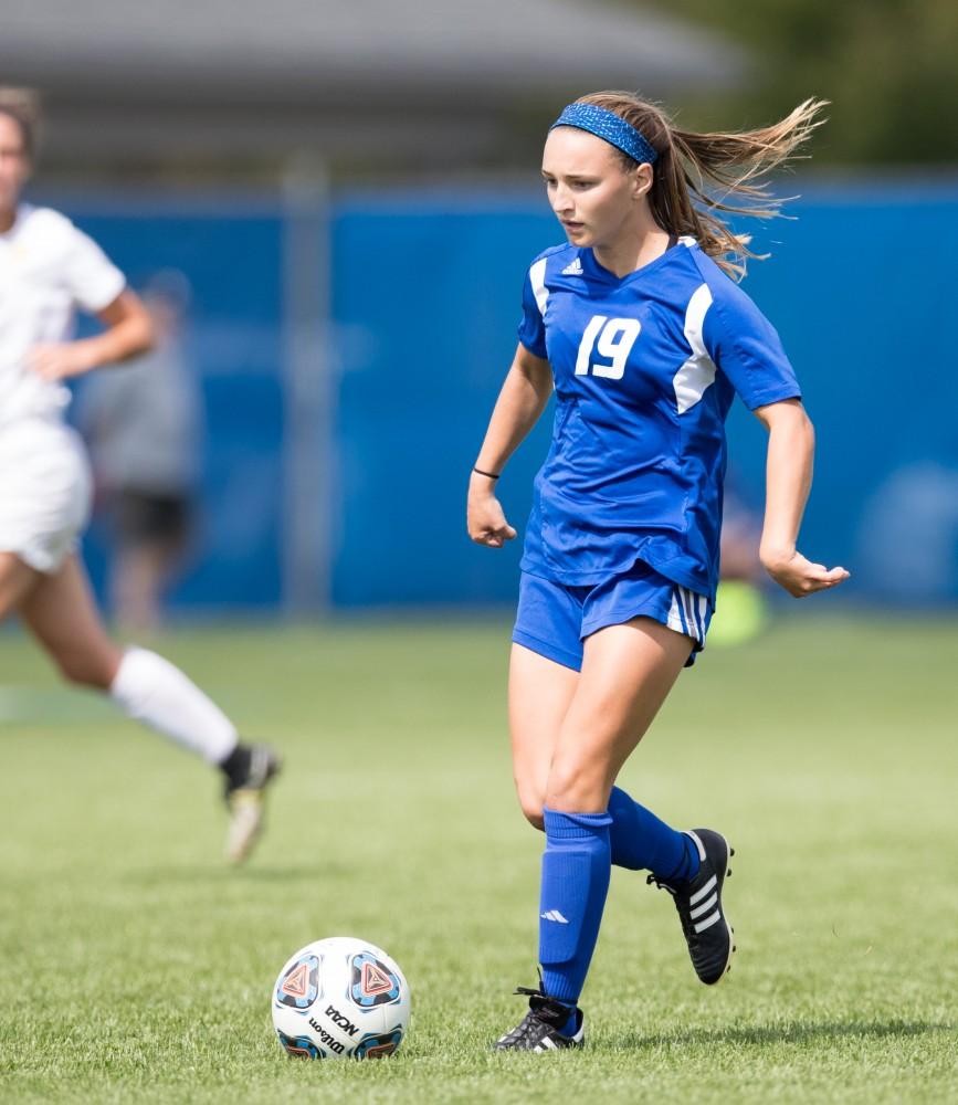 GVL/Kevin Sielaff - Mia Gale (19) passes the ball in front of the Panthers' net. The Lakers defeat the Panthers of Ohio Dominican with a final score of 4-0 on Sunday, Sept. 18, 2016 in Allendale.