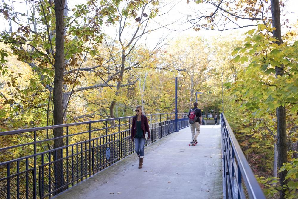 GVL / Sara Carte
Grand Valley students walk across the blue birdge on Tuesday, Oct. 18, 2016.