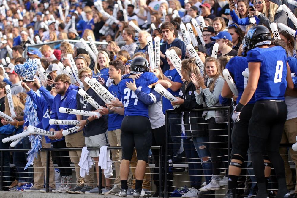 GVL / Emily Frye
Caleb Richard hugs a fan in the stands before the game against Truman State on Saturday Oct. 15, 2016.