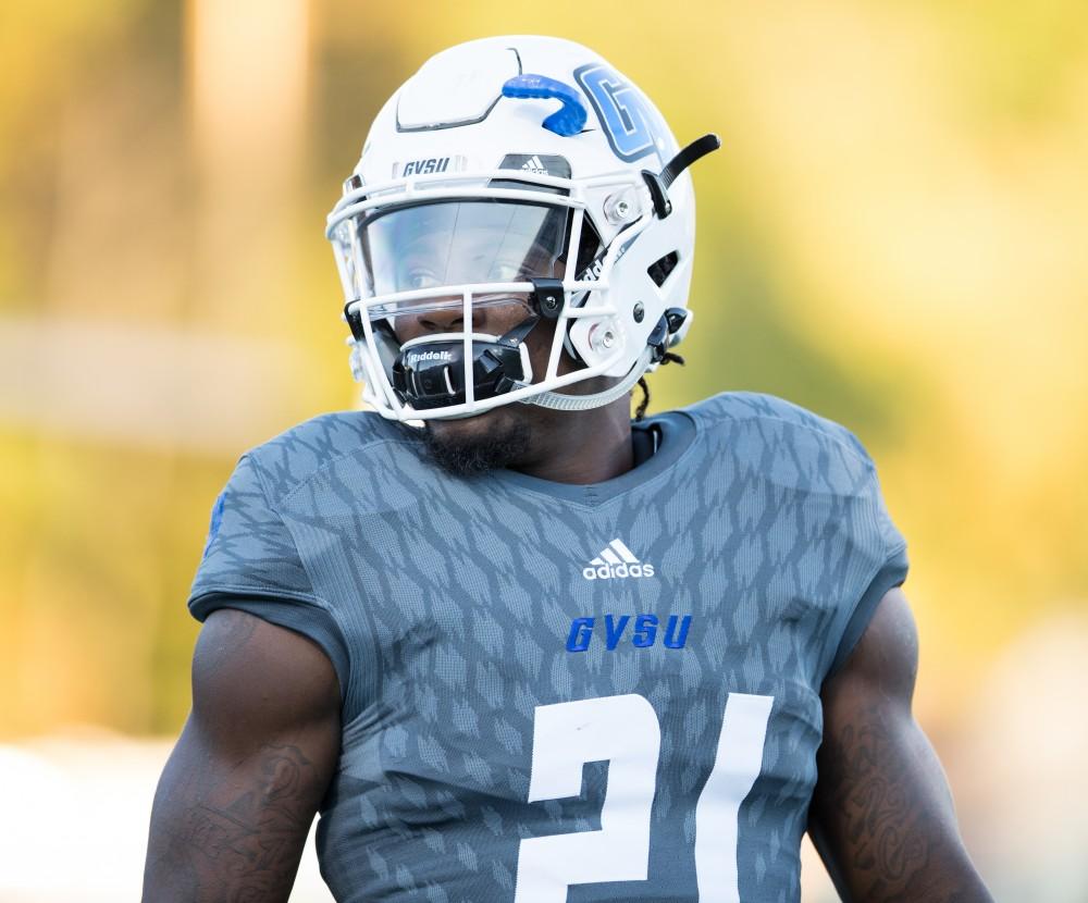 GVL/Kevin Sielaff - Marty Carter (21) warms up before the start of the match. The Lakers defeat the Bulldogs of Ferris State University Saturday, Oct. 8, 2016 with a final score of 35-23 in Allendale. 