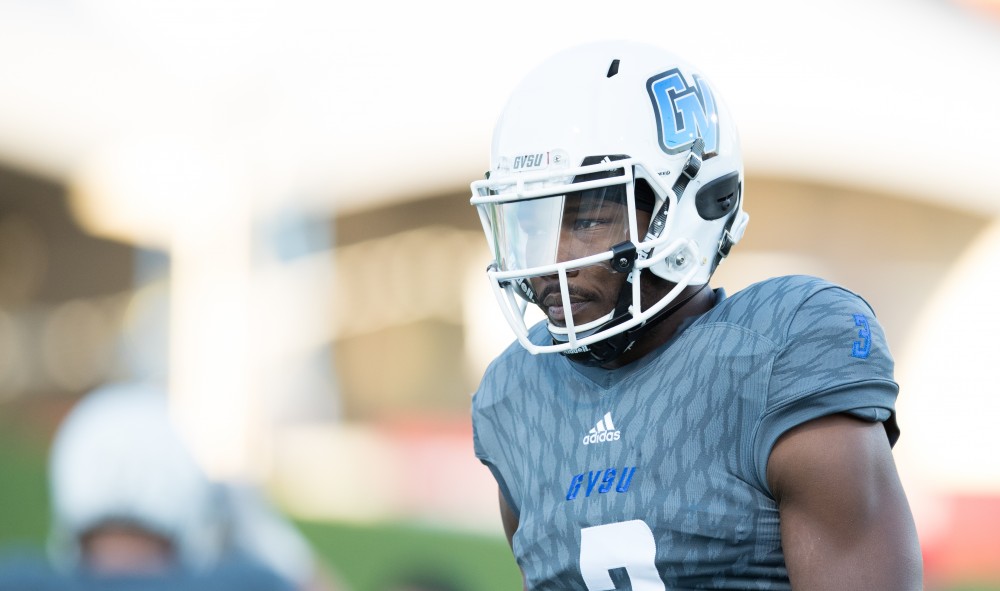 GVL/Kevin Sielaff - Brandon Bean (3) warms up on the sideline. The Lakers defeat the Bulldogs of Ferris State University Saturday, Oct. 8, 2016 with a final score of 35-23 in Allendale. 