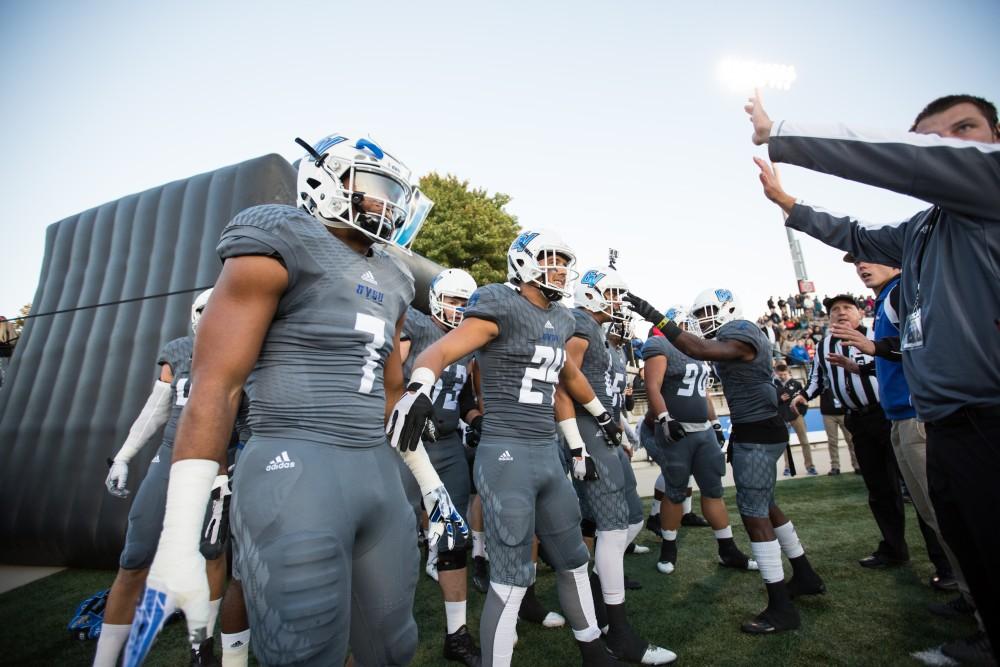 GVL/Kevin Sielaff - David Talley (7) and company prepare to storm the field as the pre-game show winds down. The Lakers defeat the Bulldogs of Ferris State University Saturday, Oct. 8, 2016 with a final score of 35-23 in Allendale. 