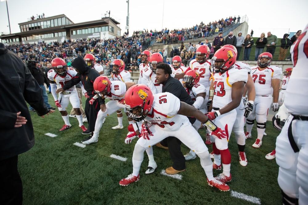 GVL/Kevin Sielaff - Ferris State gets fired up on the sideline as they prepare to take the field. The Lakers defeat the Bulldogs of Ferris State University Saturday, Oct. 8, 2016 with a final score of 35-23 in Allendale. 