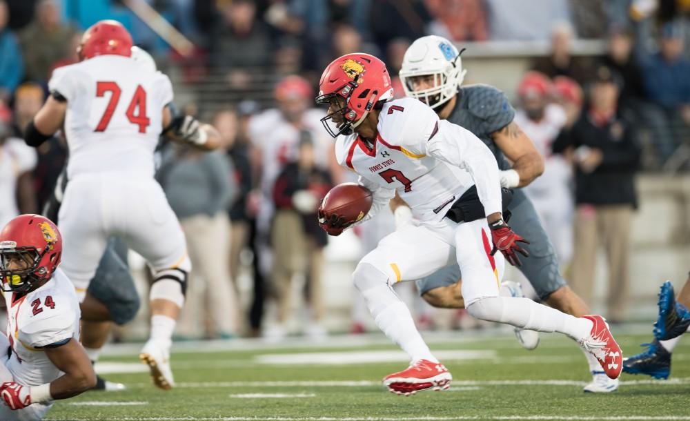 GVL/Kevin Sielaff - Ferris State QB Reggie Bell (7) splits Grand Valley's defense and continues up field with the quarterback keeper. The Lakers defeat the Bulldogs of Ferris State University Saturday, Oct. 8, 2016 with a final score of 35-23 in Allendale. 