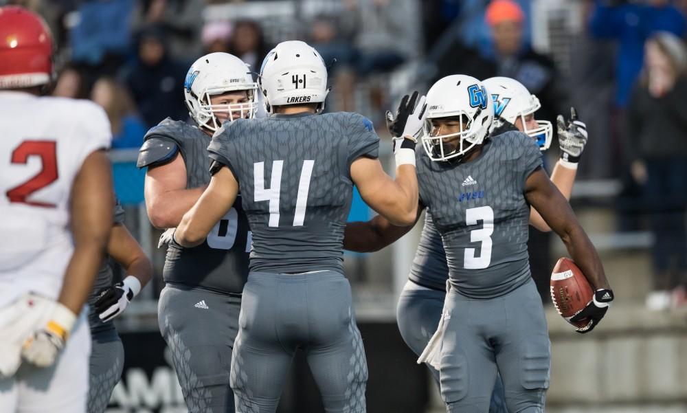 GVL/Kevin Sielaff - Brandon Bean (3) and company celebrate a Grand Valley touchdown. The Lakers defeat the Bulldogs of Ferris State University Saturday, Oct. 8, 2016 with a final score of 35-23 in Allendale. 