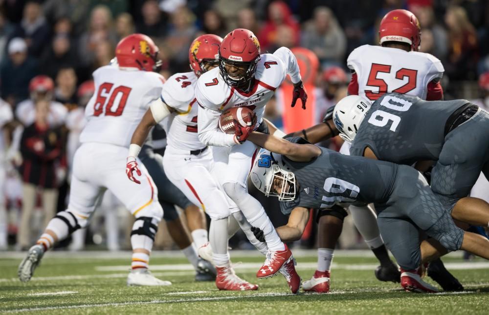 GVL/Kevin Sielaff - Ferris State QB Reggie Bell (7) is brought down by Grand Valley's Collin Schlosser (49) after a short gain. The Lakers defeat the Bulldogs of Ferris State University Saturday, Oct. 8, 2016 with a final score of 35-23 in Allendale. 