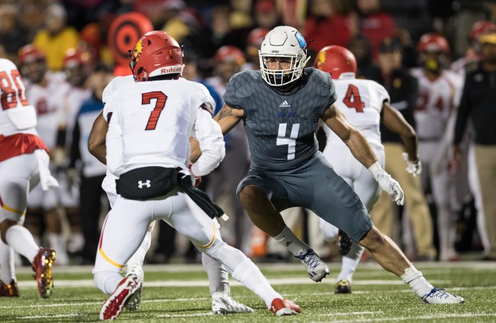 GVL/Kevin Sielaff - Alton Voss (4) moves in on Ferris State's Reggie Bell (7). The Lakers defeat the Bulldogs of Ferris State University Saturday, Oct. 8, 2016 with a final score of 35-23 in Allendale. 